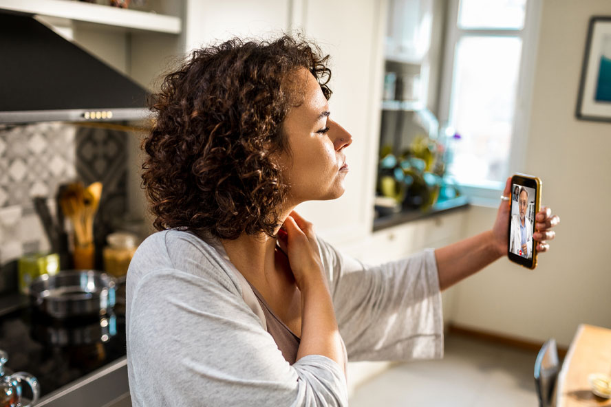 Woman using her phone for a virtual health appointment