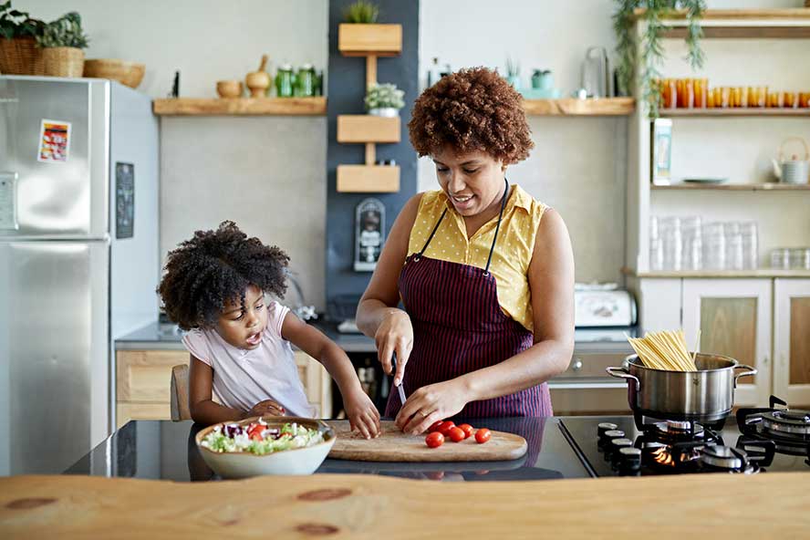 family-cooking Woman and child cooking in a kitchen